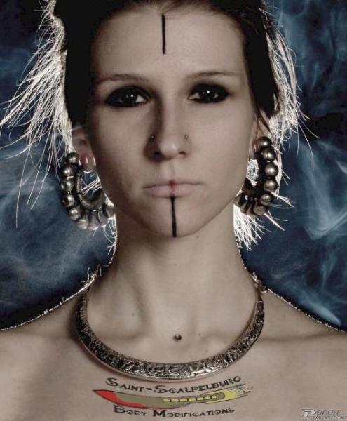Female with nose and dermal piercings by Arseniy Andersson