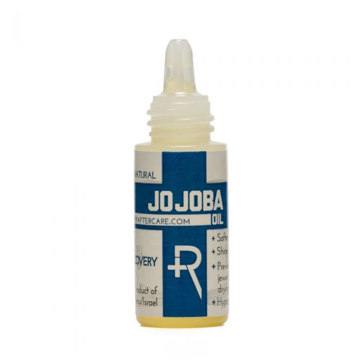 Photo of bottle of Jojoba oil for lubricating piercings