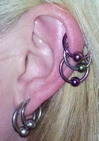 Triple Helix Piercings and Multiple Earlobe Piercings