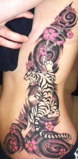 Ribcage Tattoo of a Tiger & Flowers by Cliff Kealoha, Jr.