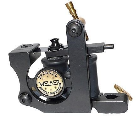 Welker coil tattoo machine on a white backdrop