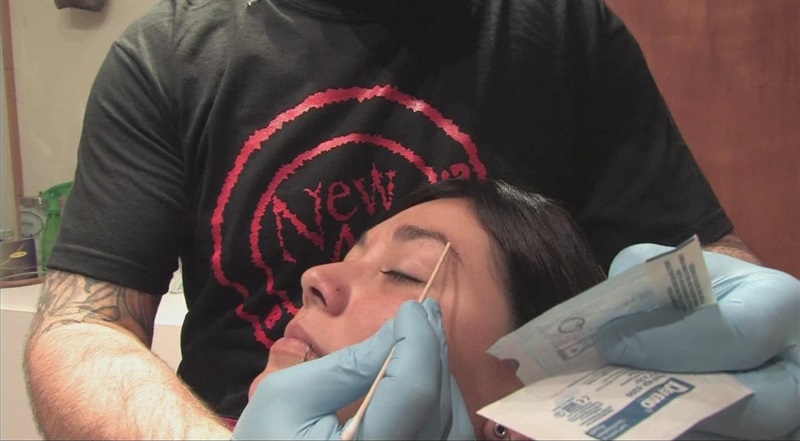 Girl Getting Her Eyebrow Pierced