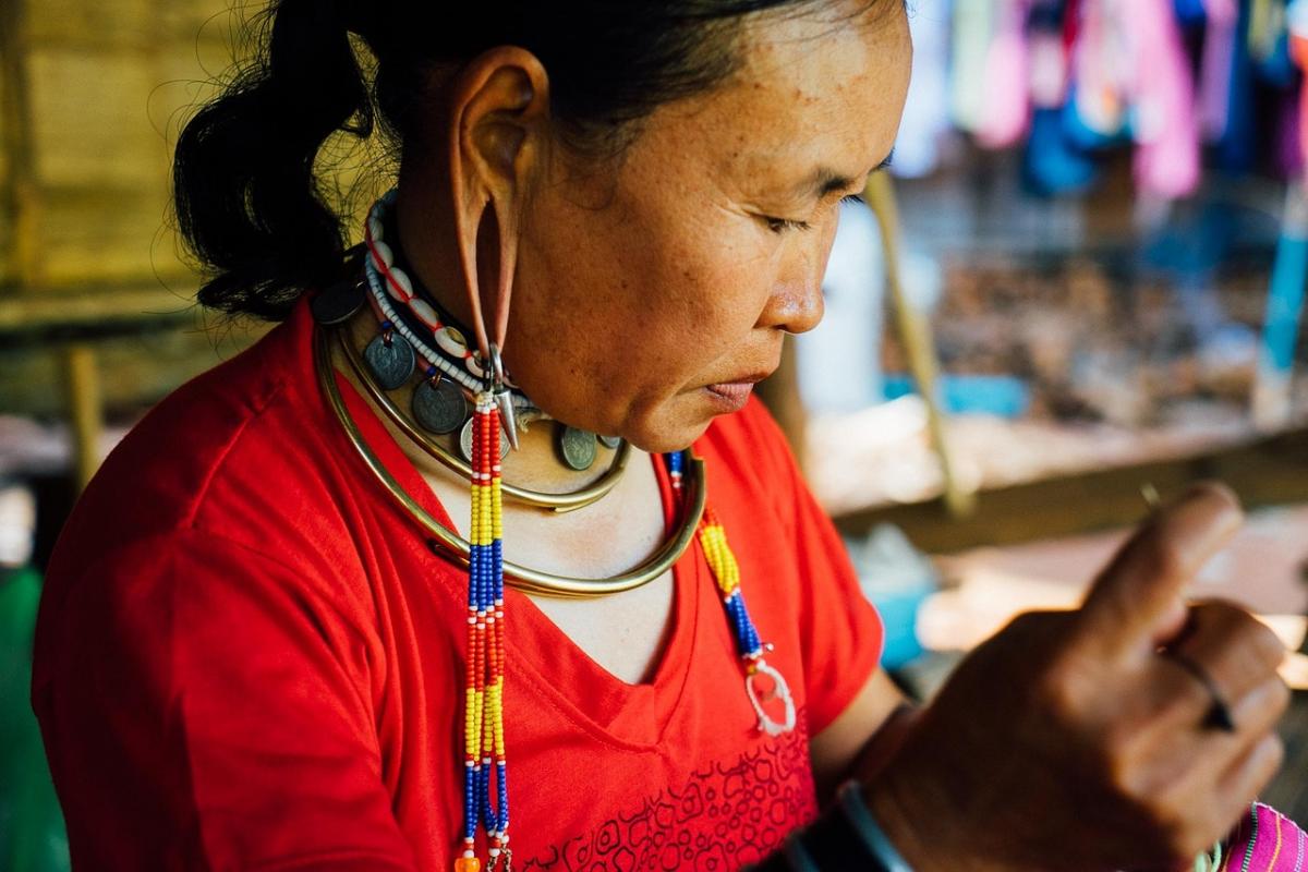 Woman with stretched piercings in tribal culture