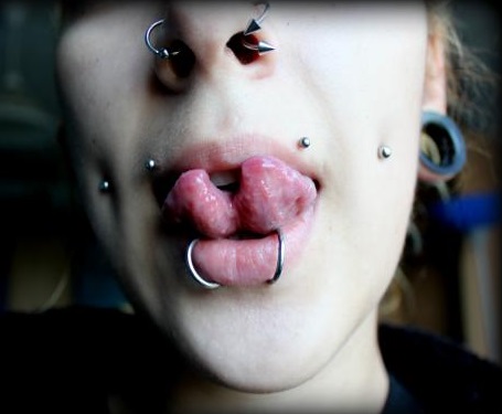 Cheek Piercings, Lip Piercings, Nostril Piercings, and Split Tongue 