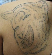 Bad Tattoo of an Animal's Head 