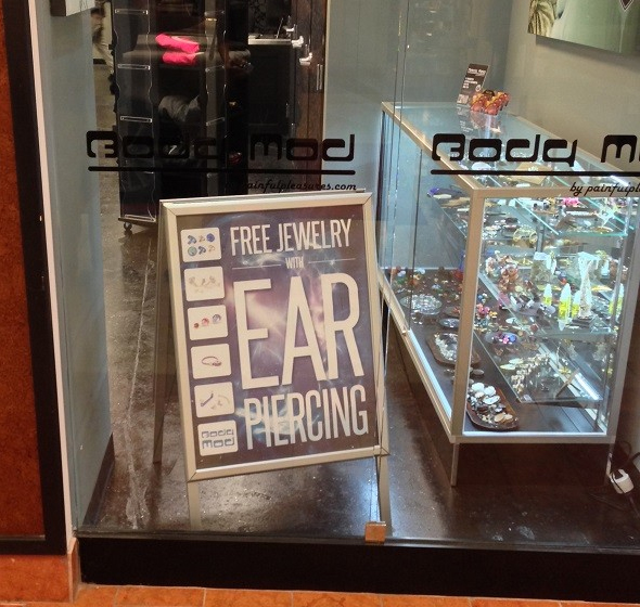 Custom Sidewalk Sign Featuring an Ear Piercing Special at Body Mod Ink 