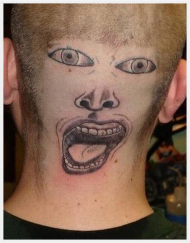 Bad Tattoo of a Terrible Cartoon Face on the Back of a Man's Head and Neck 