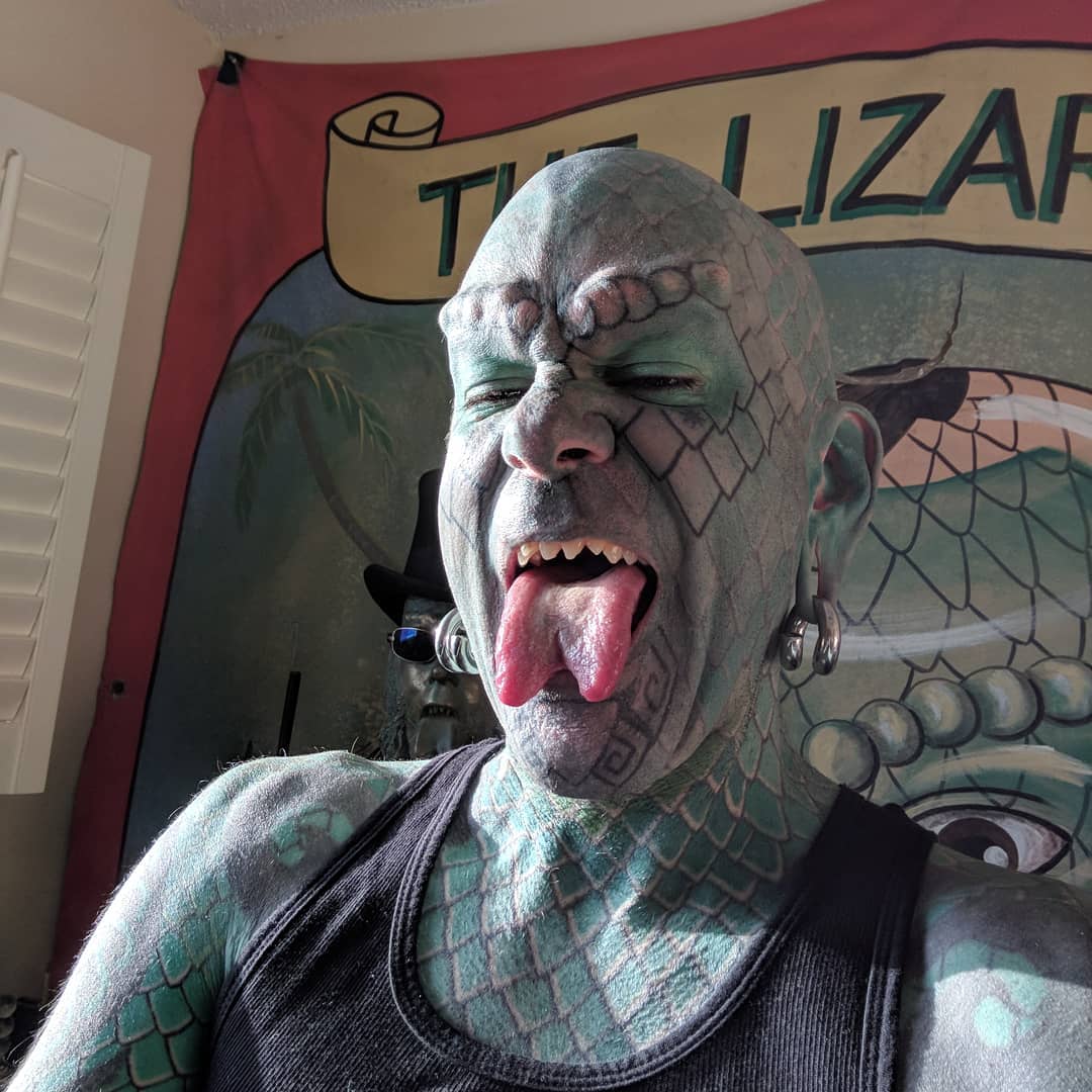 Photo of Erik Sprague, professional lizard man freak with split tongue