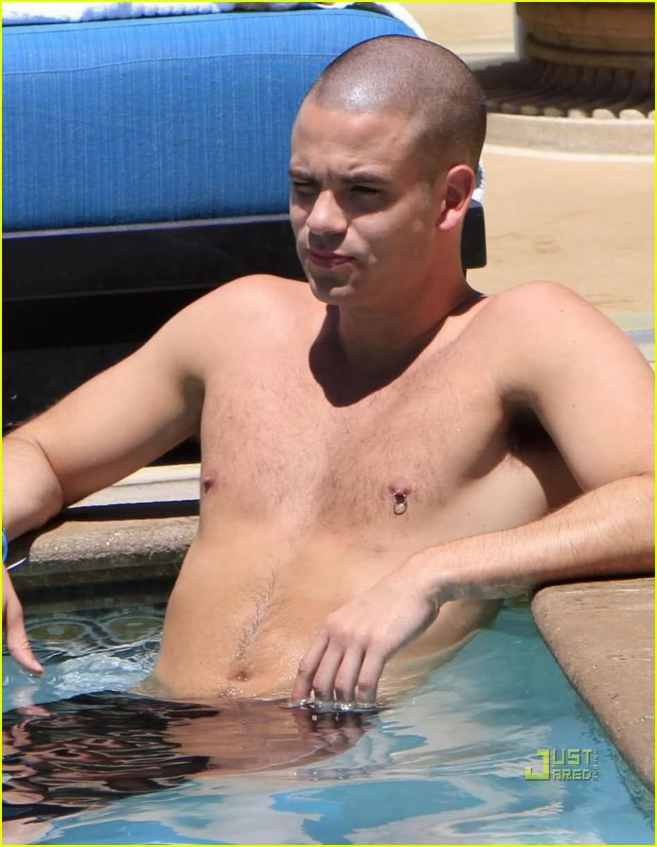 Man With Nipple Piercings in a Pool 