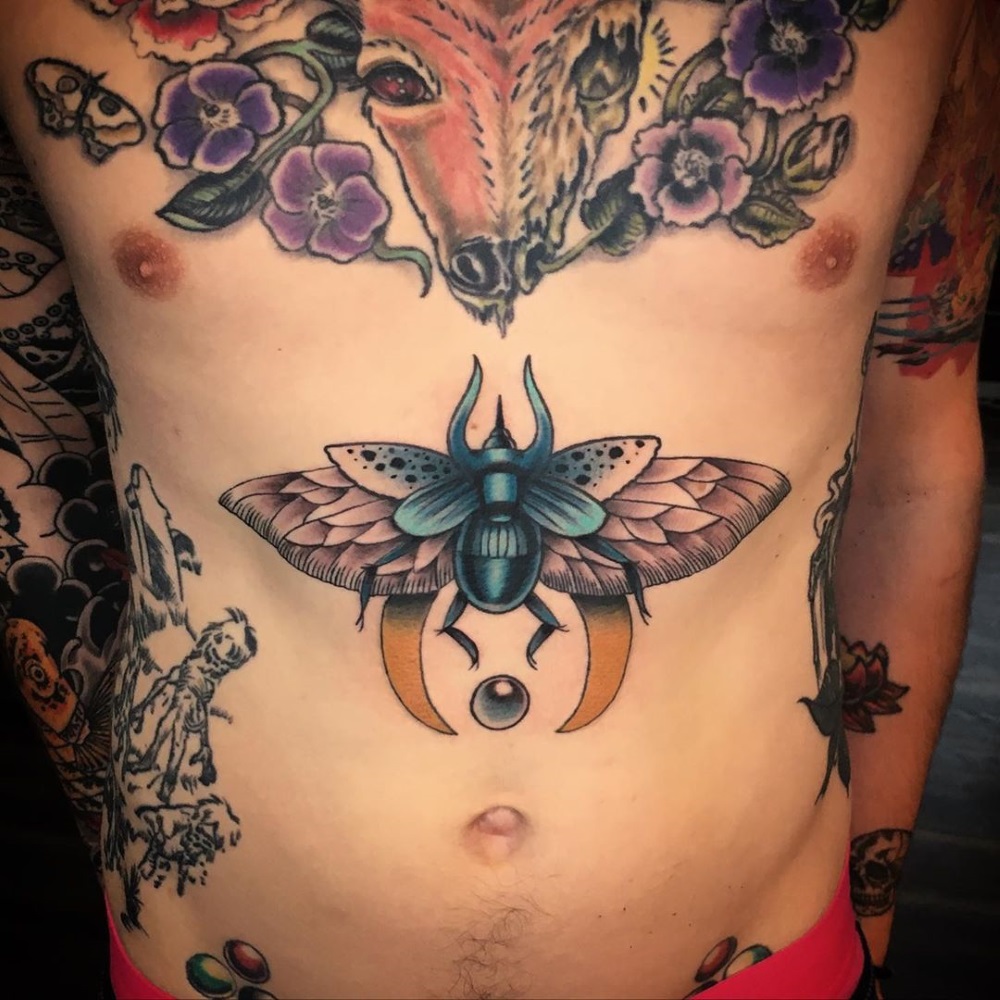 Scarab sternum tattoo by tattoo artist Mandy Fabrizi