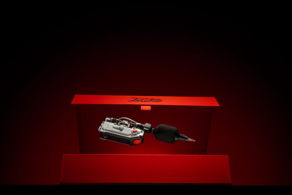 InkJecta Flite X1 Crossfire wireless tattoo machine levitating out of package