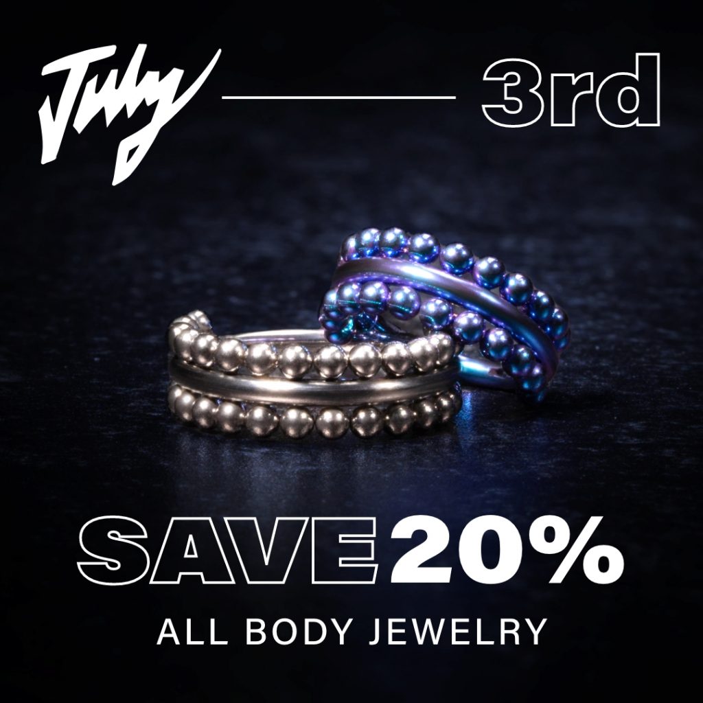 Shot of body jewelry with blue backdrop