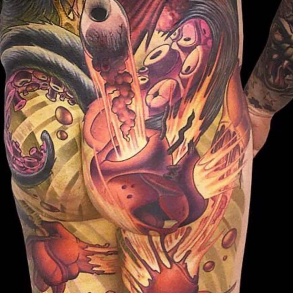 Tattoo client with butt tattoo