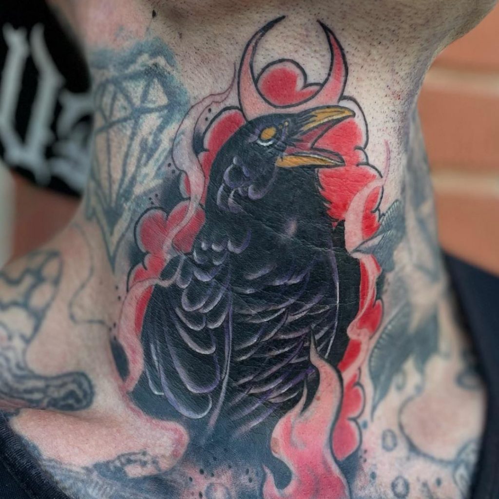 Tattoo client with raven tattoo on throat