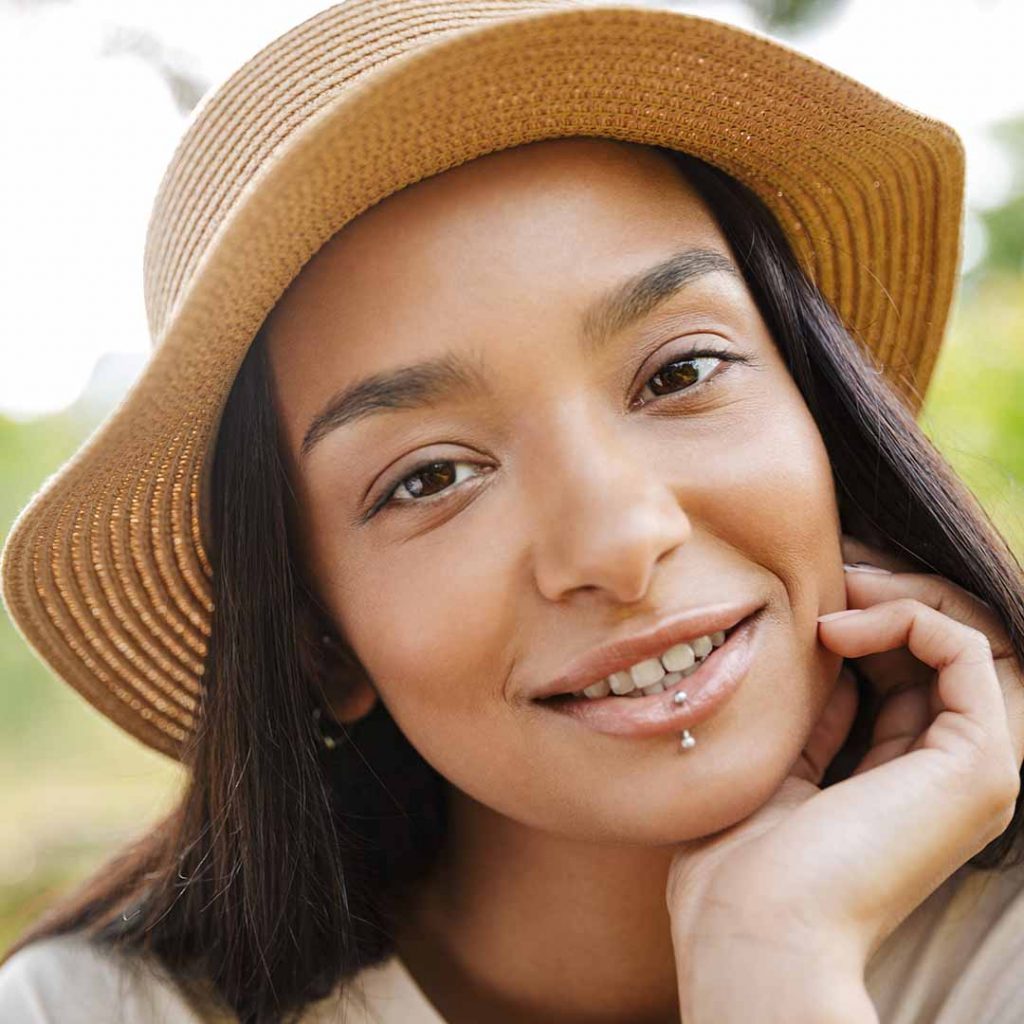 Smiling girl with lip piercing