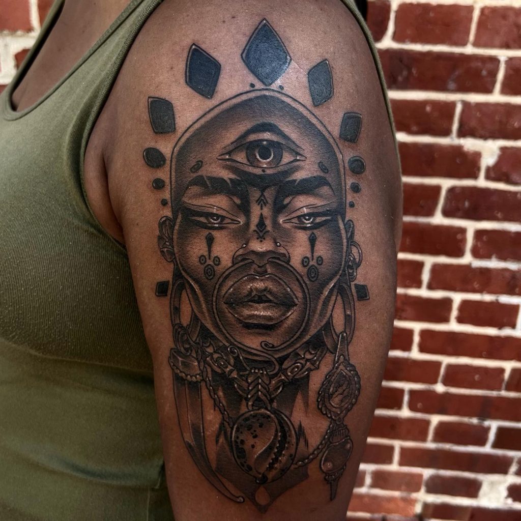 Arm tattoo on black client by tattoo artist Oba Jackson