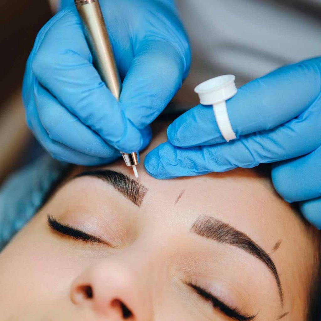 PMU client getting a microblading procedure