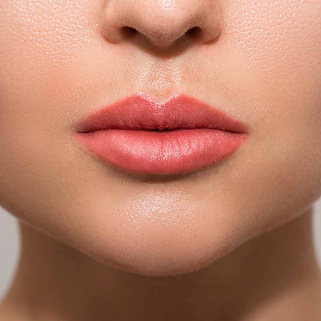 Client after PMU lip blush procedure