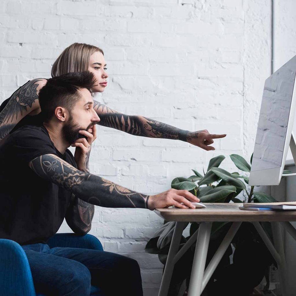 Tattoo artist doing taxes with assistance