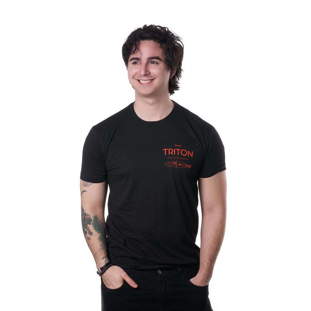 Tattooed man wearing merch