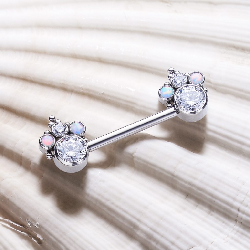 Titanium threadless nipple barbell with jeweled ends that have opal accents