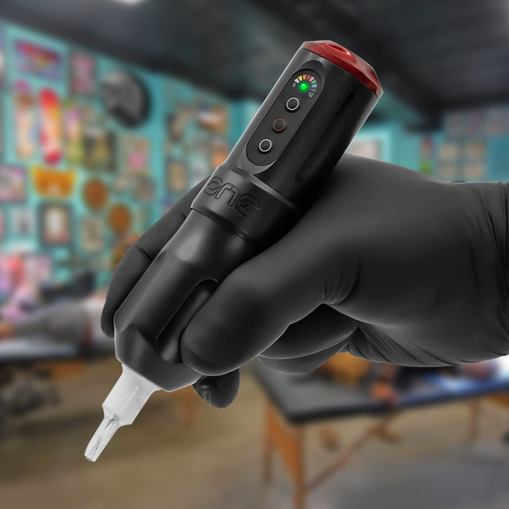 Tattoo artist hand holding FK Irons ONE machine in a shop
